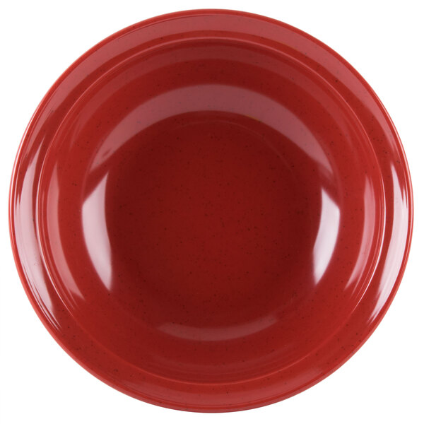 A close-up of a red GET Geneva bowl with speckled specks.