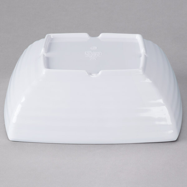 A white square bowl with a lid.