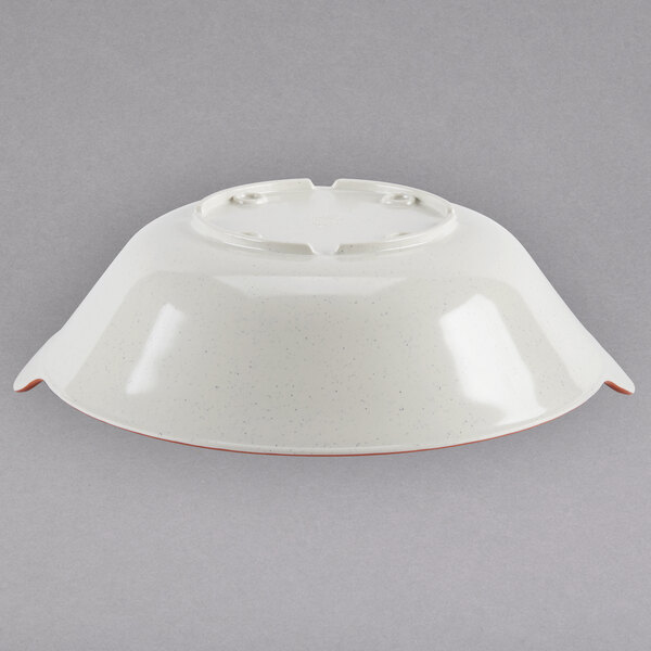 A white melamine bowl with a red edge.