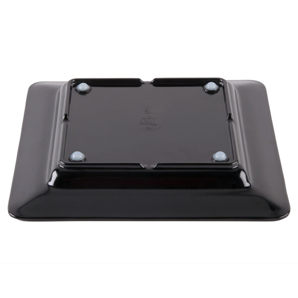 A black square Milano melamine plate with two holes on it.