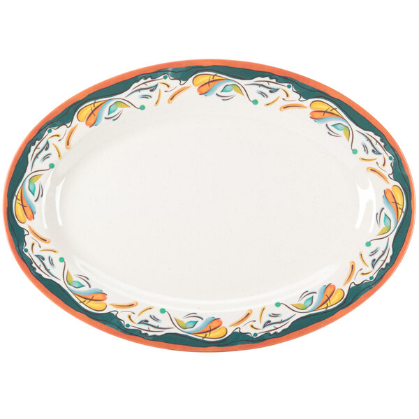A white oval platter with orange and green design.