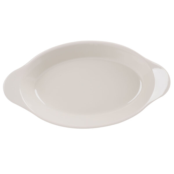 An ivory oval side dish with a white background.
