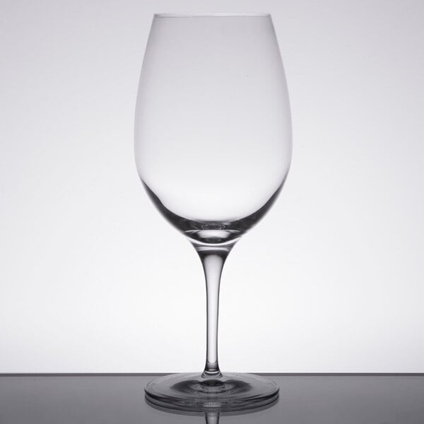 A clear Stolzle Bordeaux wine glass on a table.