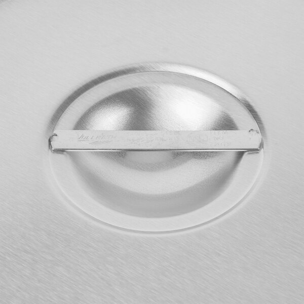 A close up of a Vollrath stainless steel solid cover.