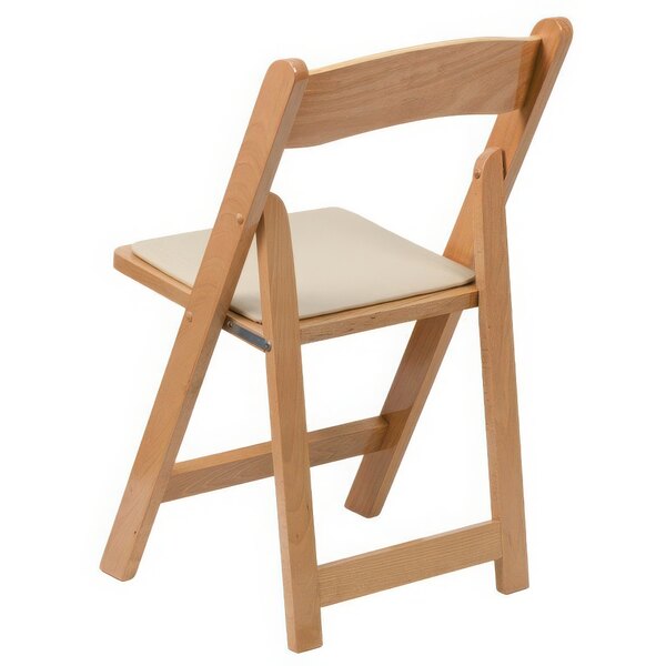 A wooden folding chair with a white cushion.