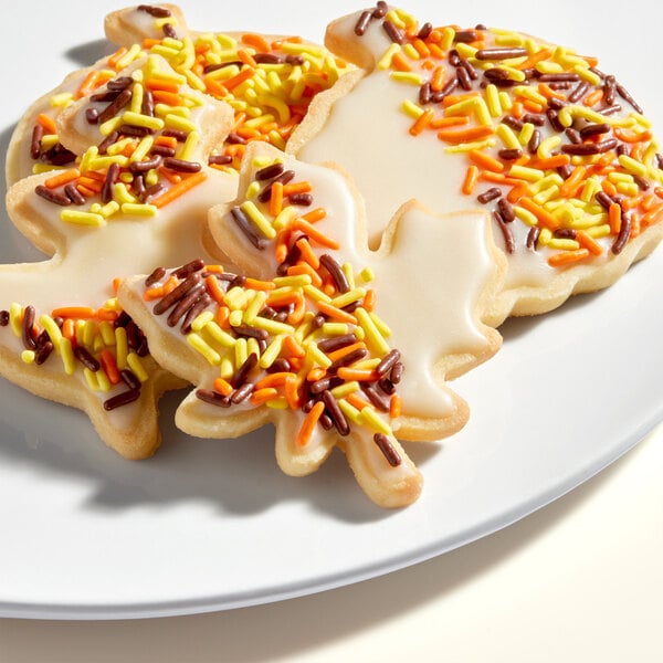 A plate of fall-themed sugar cookies with Adourne Autumn Sprinkles.