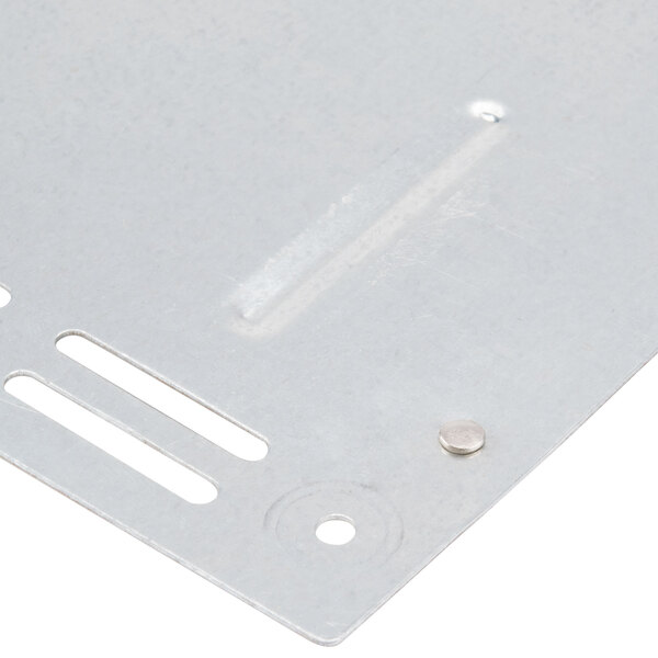 A close-up of a Waring bottom cover plate for toasters with two holes and a screw.