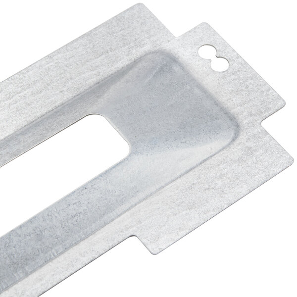 A metal plate with a hole in it, used in Waring toasters.