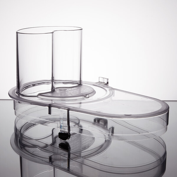 A clear plastic container with a black handle for a Waring continuous feed head.