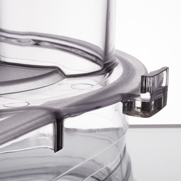 A clear plastic lid with a black rim.