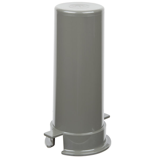 A close-up of a small gray plastic pusher.