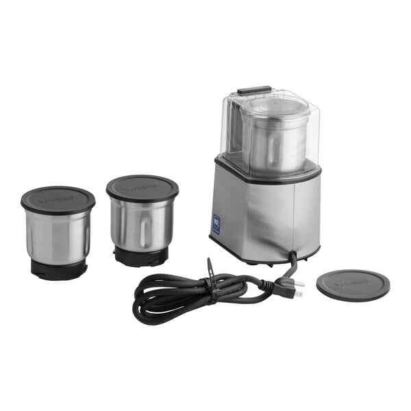 A commercial spice grinder with a stainless steel base, three metal grinding bowls with lids, and a power cord.