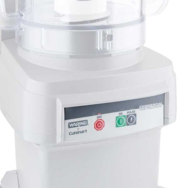 A white Waring food processor with buttons and a clear cover.