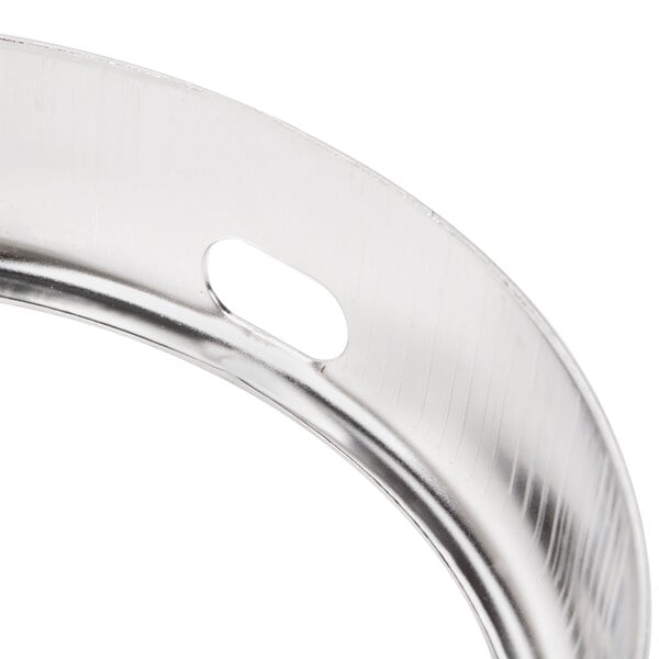 A close-up of a stainless steel bowl guard for an Avantco MX10 mixer.