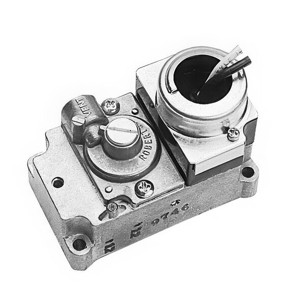 A Waring relay with a round metal piece with a hole in it.