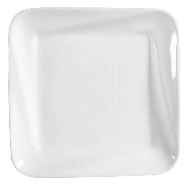A CAC bright white square porcelain plate with a curved edge.