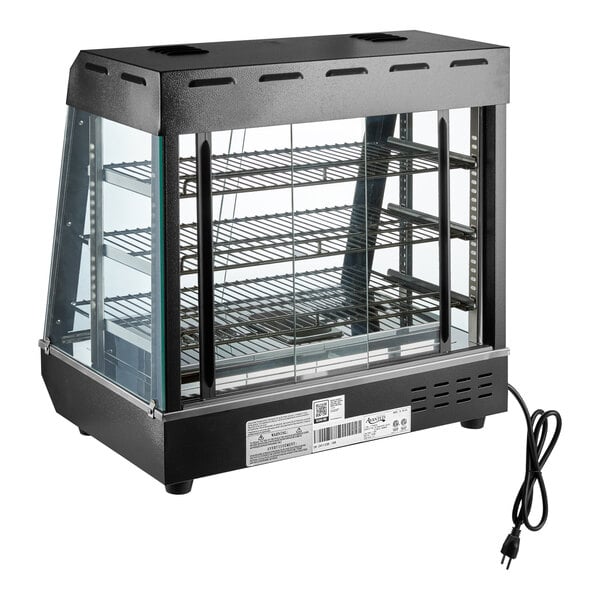 A countertop heated display case with three wire shelves, glass sides, and sliding doors, designed for keeping food warm.
