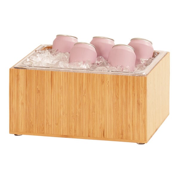 A Cal-Mil bamboo ice housing with pink cans in it.