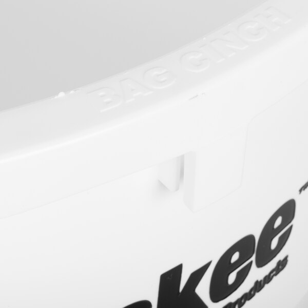 A close-up of a white Continental Huskee trash can, lid, and dolly kit.