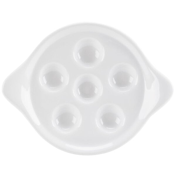 A bright white porcelain plate with six round holes.