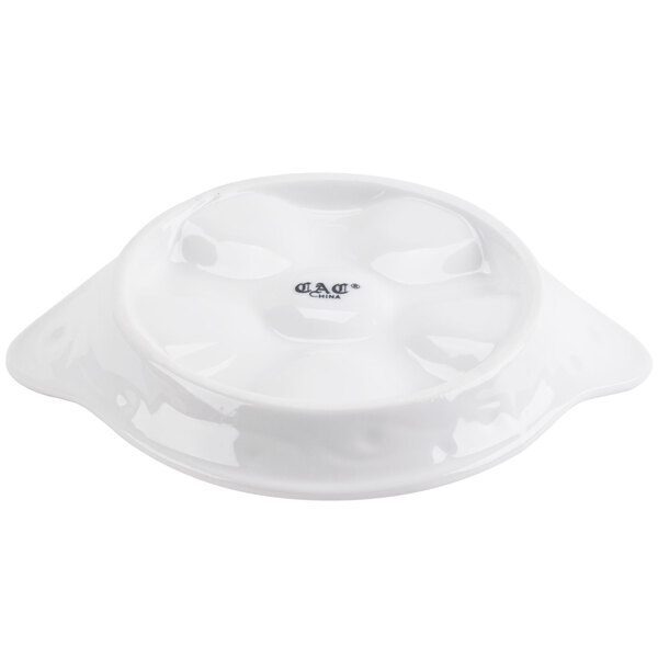 A bright white porcelain CAC Escargot dish.