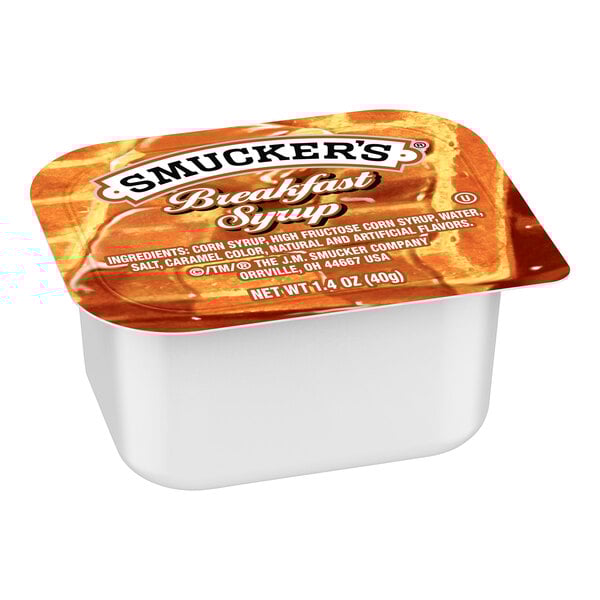 A white container of Smucker's breakfast syrup with a brown label.
