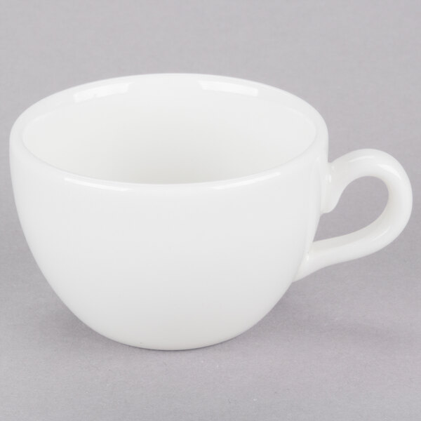 A close-up of a Homer Laughlin bright white espresso cup with a handle.