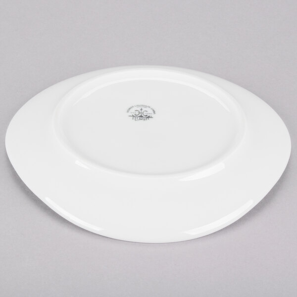 A Homer Laughlin Ameriwhite Alexa bright white china plate with a small design on it.