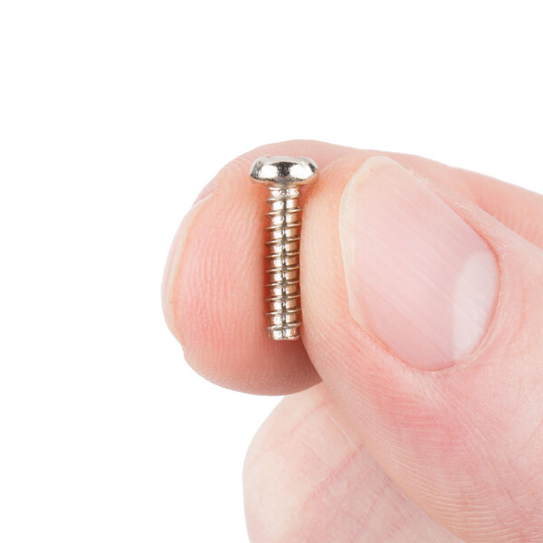A person holding a small silver Waring screw.