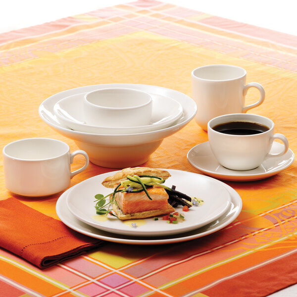 A Homer Laughlin bright white china cup on a table.