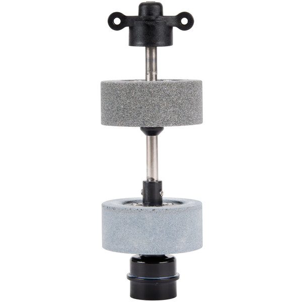 A Waring grinding wheel assembly with black and grey wheels and metal balls.