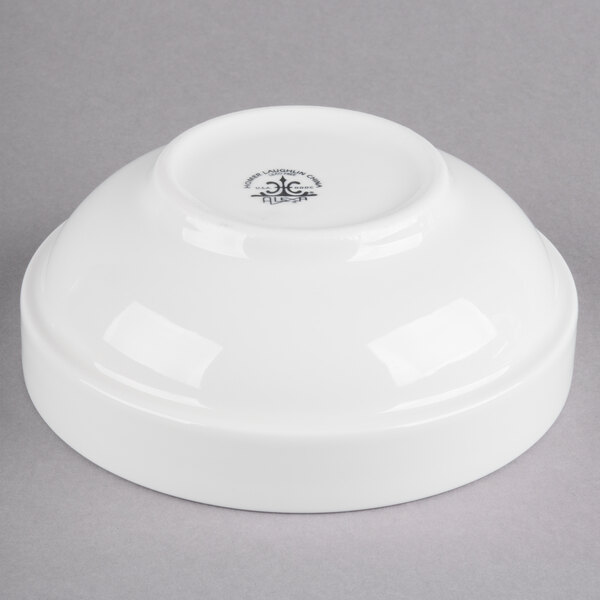 A white bowl with a logo on it.