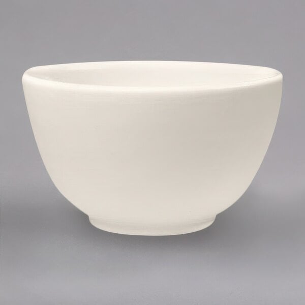 A Homer Laughlin ivory china bowl with a rolled edge.