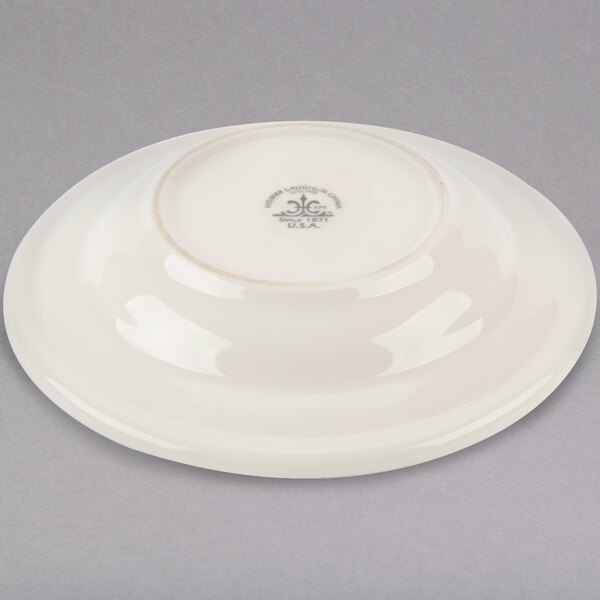 A close-up of a Homer Laughlin ivory china soup bowl with a rolled edge.