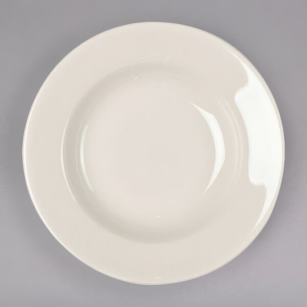 A Homer Laughlin ivory china bowl with a curved edge.