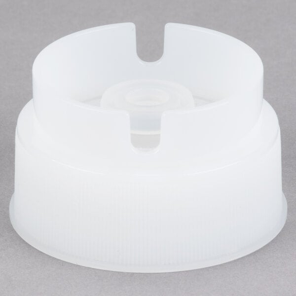 A white plastic Tablecraft INVERTAtop with a hole in it.