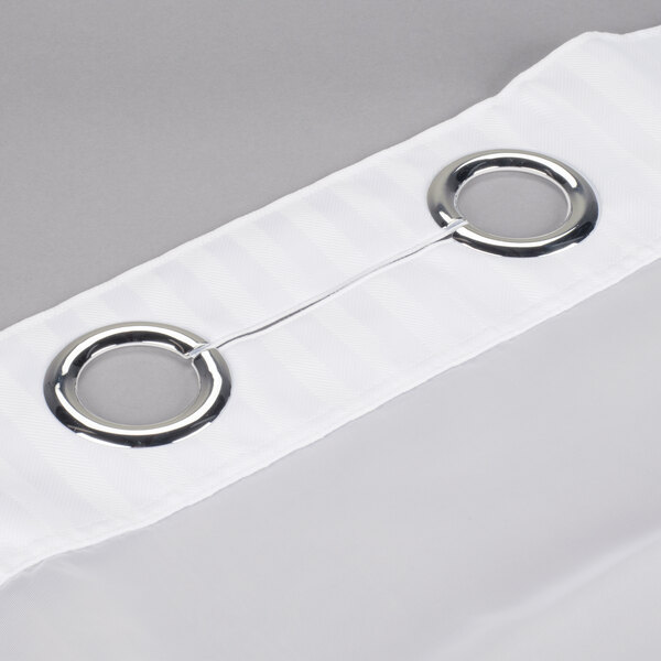 A white Hookless shower curtain with chrome rings hanging on a rod.