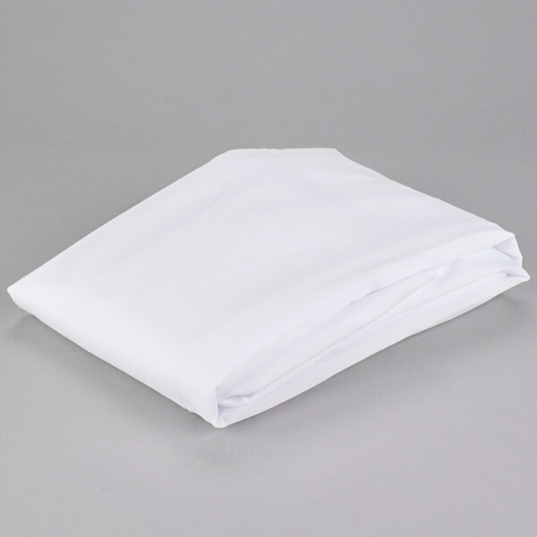 A folded Hookless white shower curtain with rings on a gray surface.