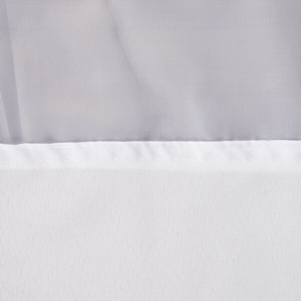 A close-up of a white Hookless shower curtain with a white border.