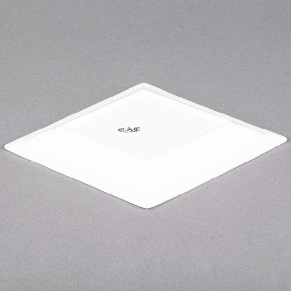 A white rectangular CAC porcelain dinner plate.