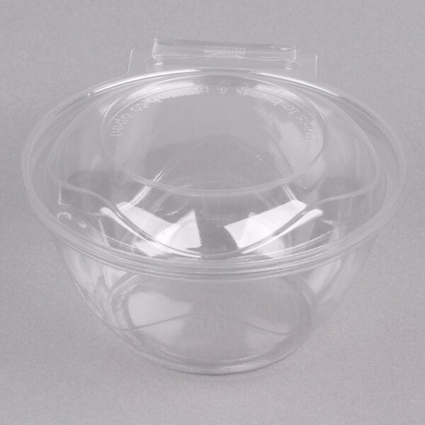A close up of a Polar Pak clear plastic bowl with a lid.