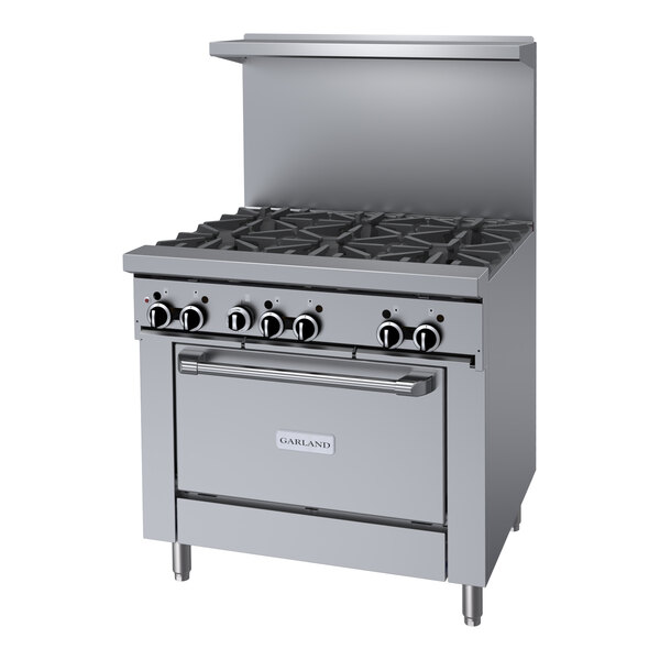 A stainless steel Garland commercial gas range with 6 burners and an oven.