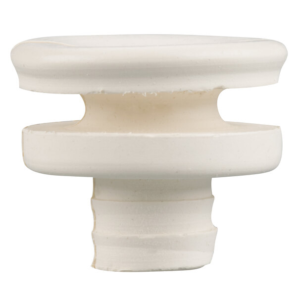 A white plastic round base with a hole in the center.