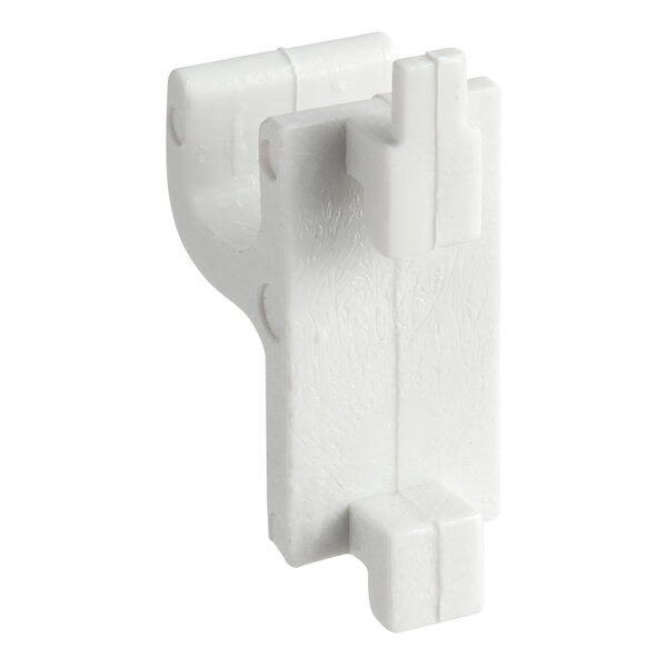 A white plastic Turbo Air shelf clip with two holes.