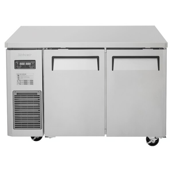 A white Turbo Air undercounter refrigerator with two doors and two drawers.