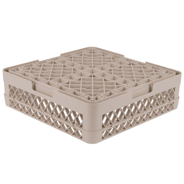 A beige plastic Vollrath Traex dish rack with a lattice pattern and holes.