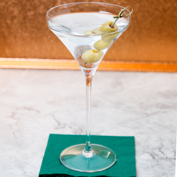 A Spiegelau Willsberger martini glass with olives on top.