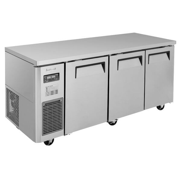 A large stainless steel Turbo Air dual temperature undercounter refrigerator / freezer with three doors and two drawers.