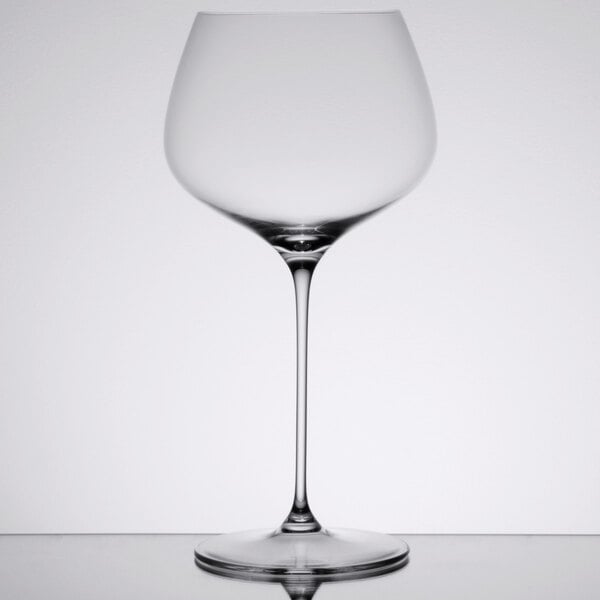 A close-up of a clear Spiegelau Willsberger Burgundy wine glass.