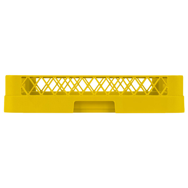 A yellow plastic Vollrath TR1 Traex open rack shelf with holes.